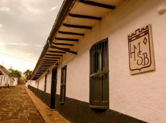 View of a colonial street in Barichara, lined with traditional houses